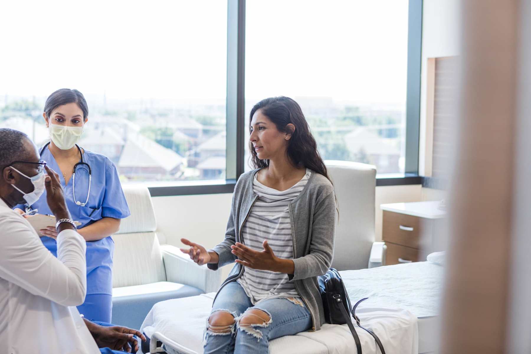 Bilingual patient talking to doctor and nurse