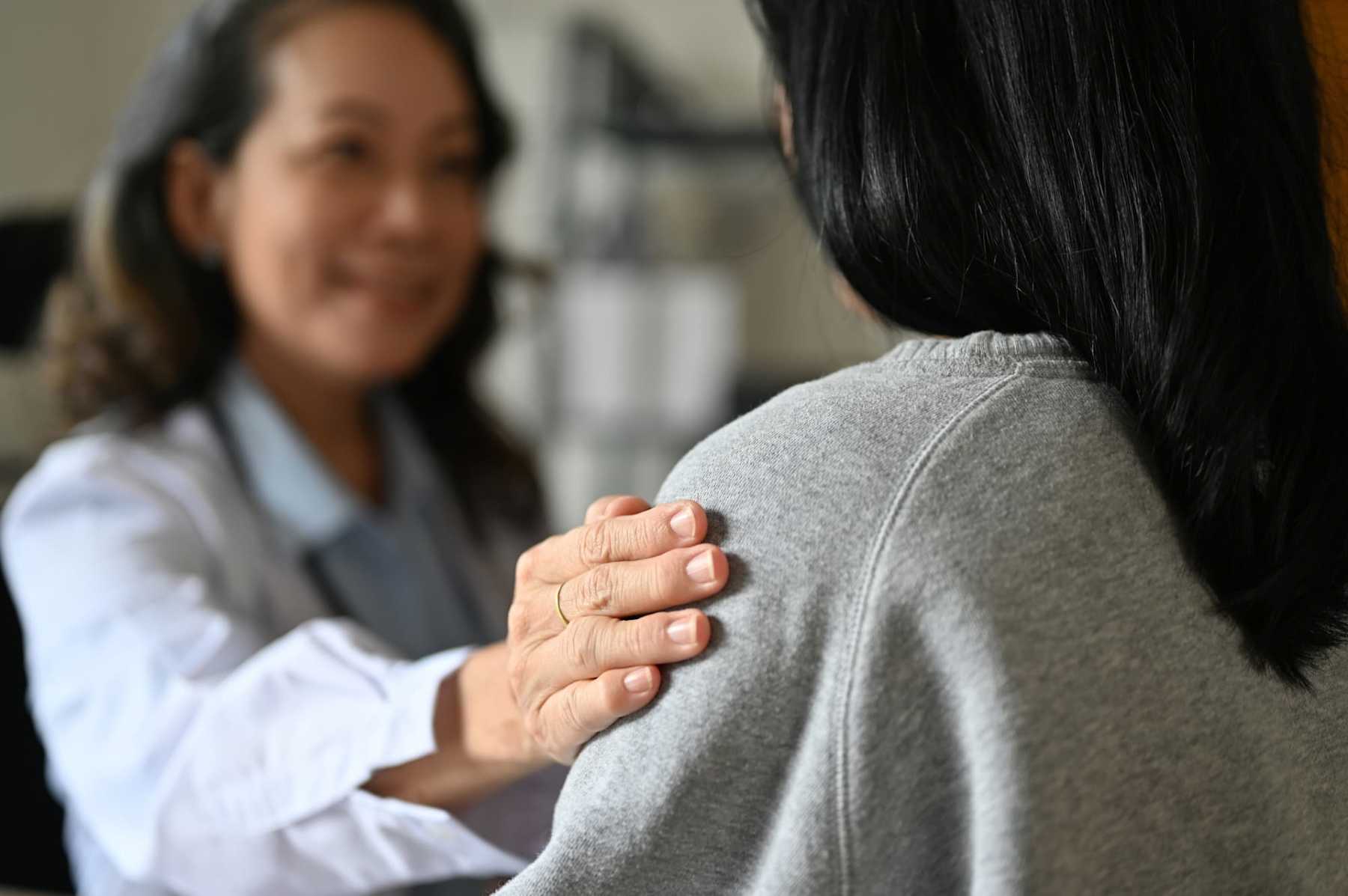 Nurse comforting patient