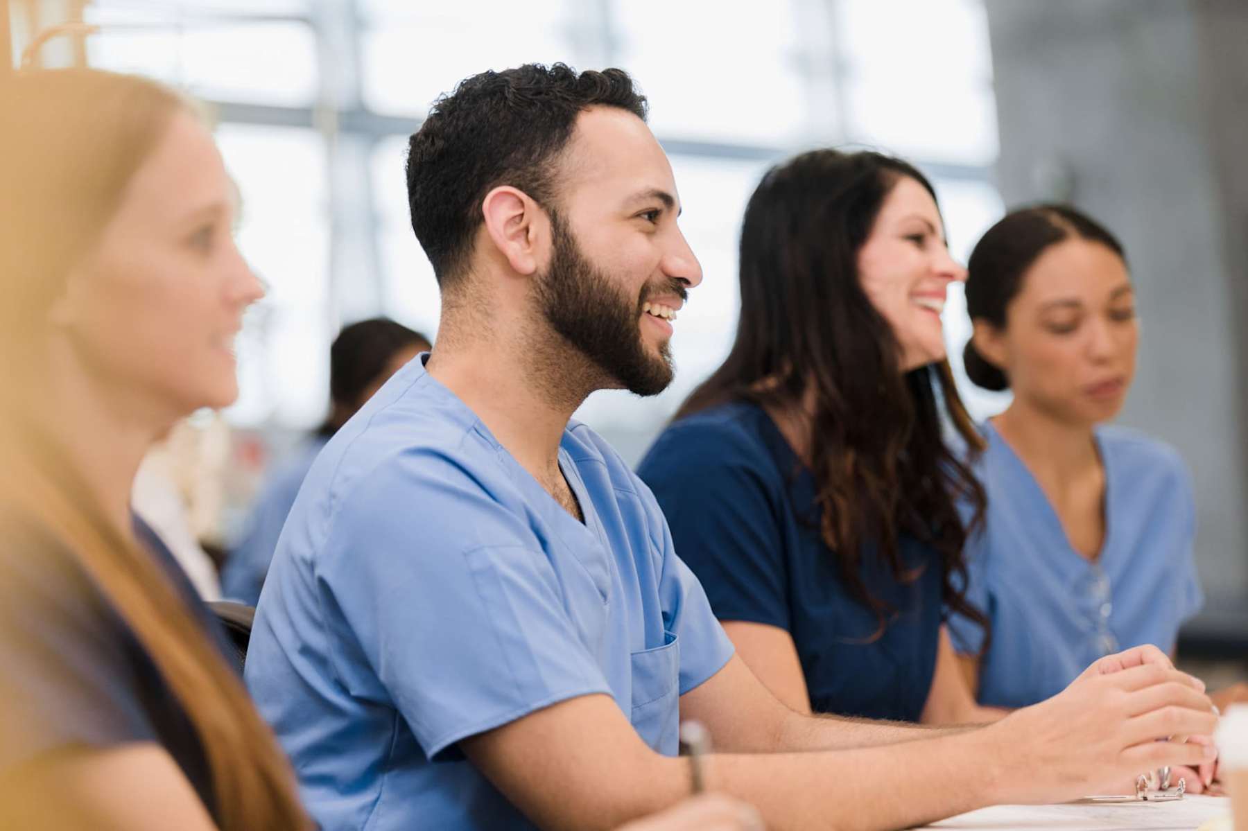 Nursing students smiling in a classroom